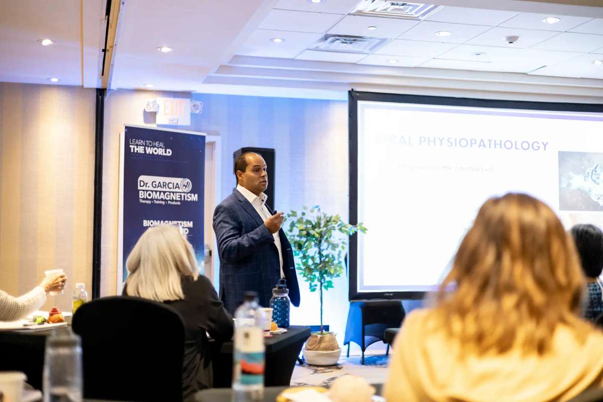Practitioner refining biomagnetism skills during training